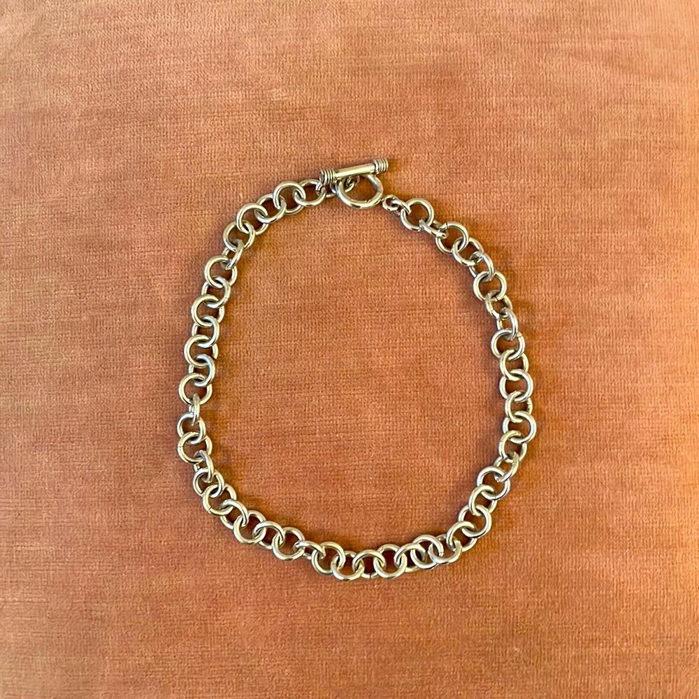 Sterling silver loop choker with toggle clasp.
